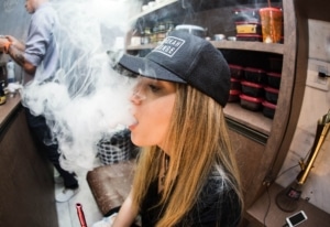 woman smokes cbd